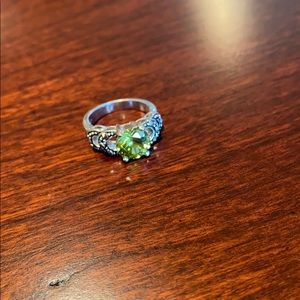 Costume jewelry silver ring with green gem